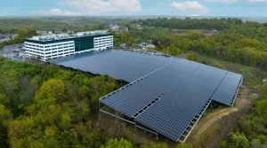 An image of the Omega Corporation campus in Pittsburgh, Pennsylvania, showing the solar canopy which covers a large parking lot.